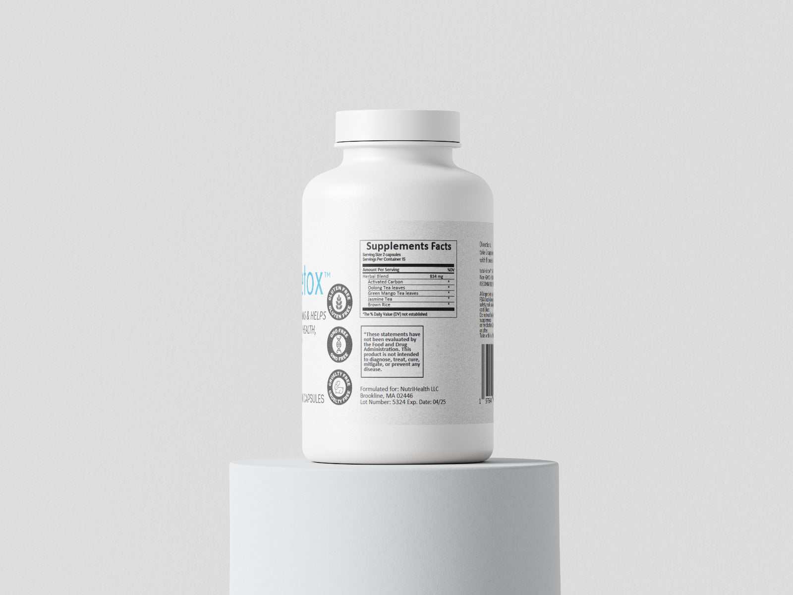 white supplement bottle of total-detox™ with label showing supplement facts on round pedestal against plain light background