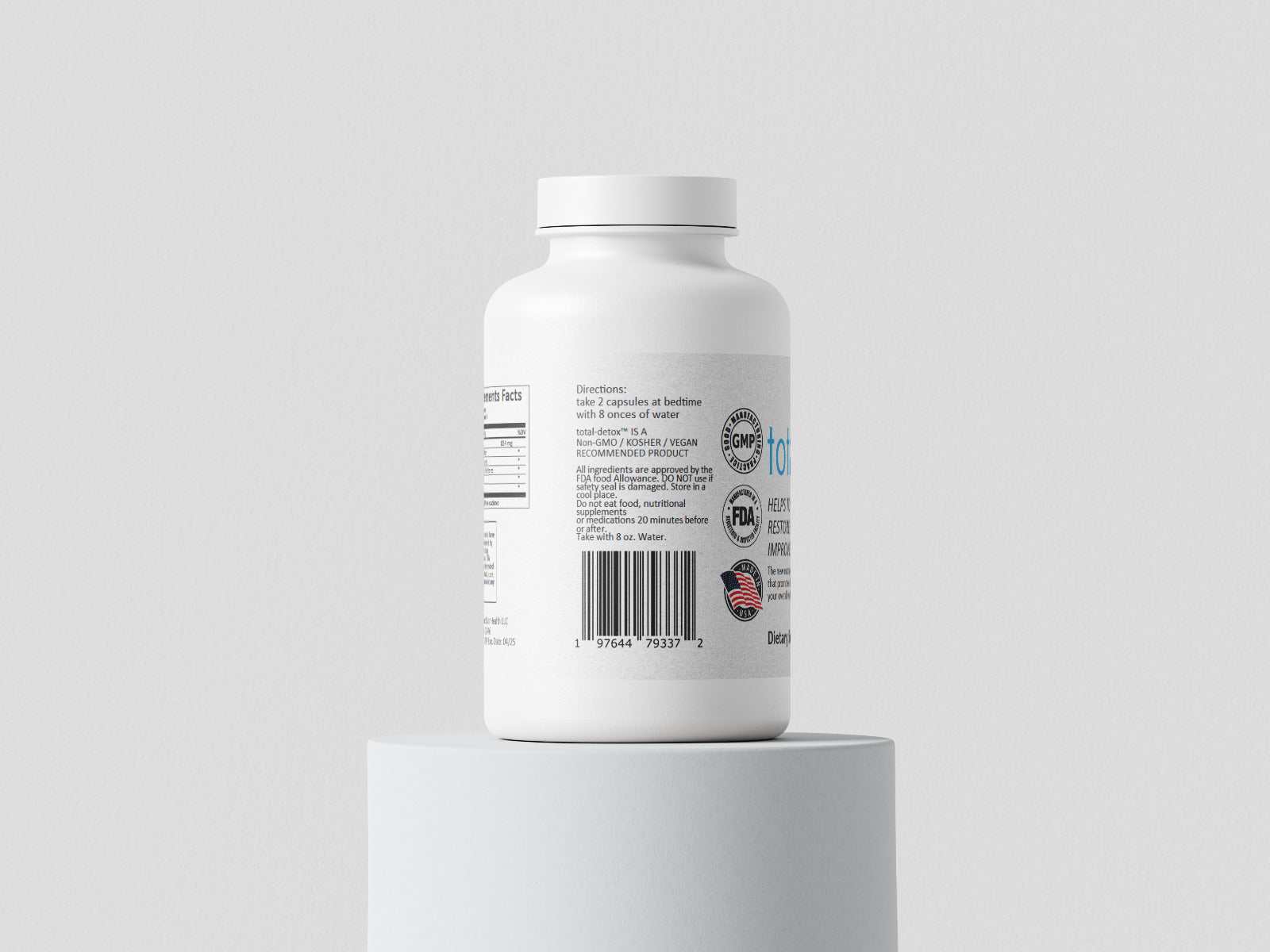 White bottle of total-detox™ supplement for toxin elimination and metabolic support on white pedestal